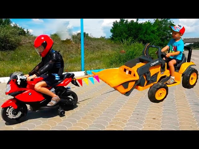 Kids Ride on Power Wheels with Motorbike and towing 12V Bulldozer - Video for Children